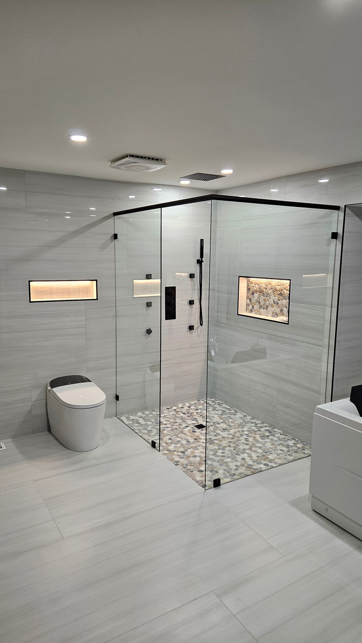 Frameless corner shower in Renton